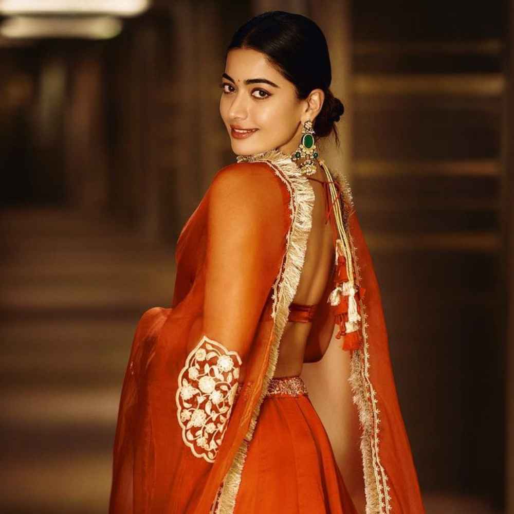 Rashmika Mandanna gives us a taste of festive glam in orange organza lehenga with gold embroidery Rashmika Mandanna gives us a taste of festive glam in orange organza lehenga with gold embroidery